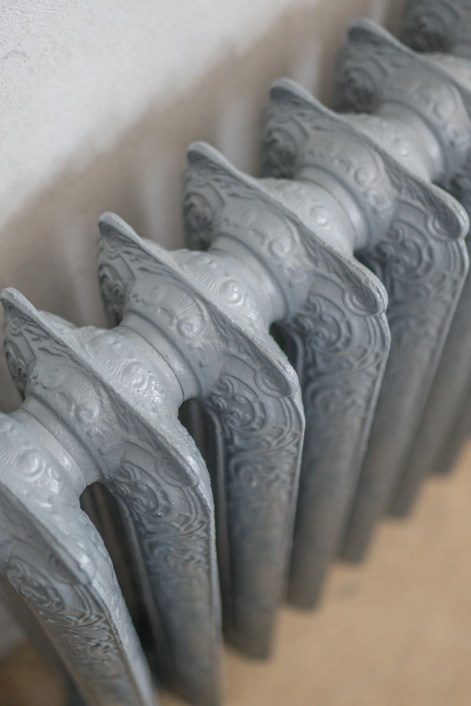 A panel radiator — at heat pump flow temperatures it runs warm rather than hot for longer periods.